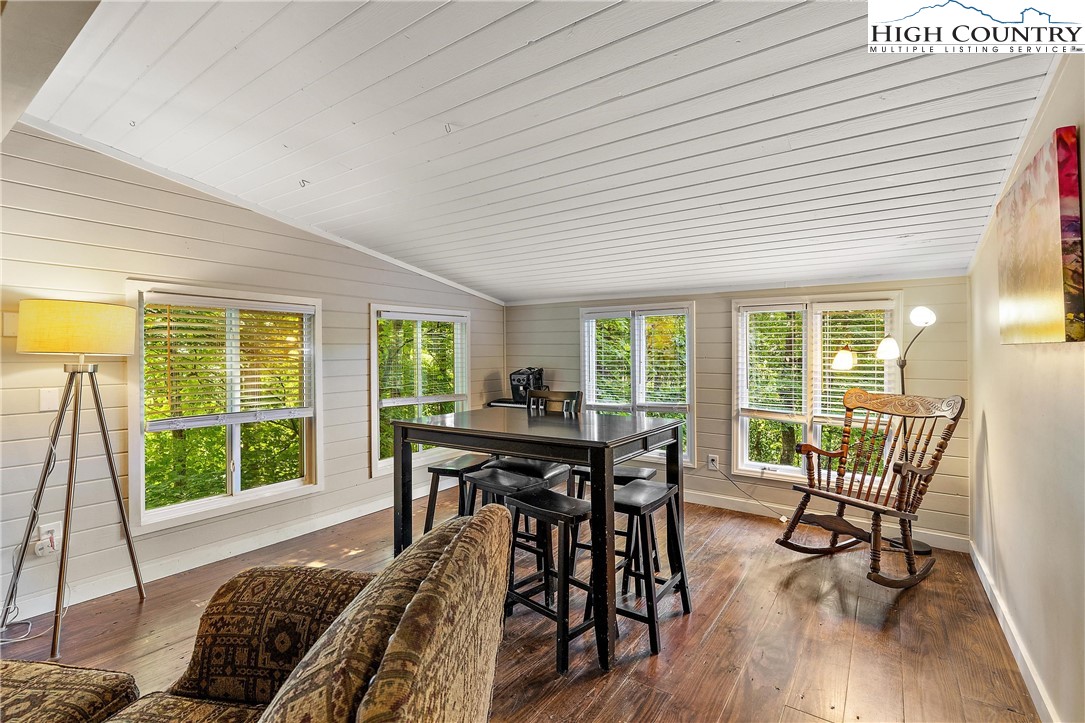 132 Sassafras Deep Gap, NC 28618 - Photo 13 of 33 a view of a dining room with furniture and wooden floor