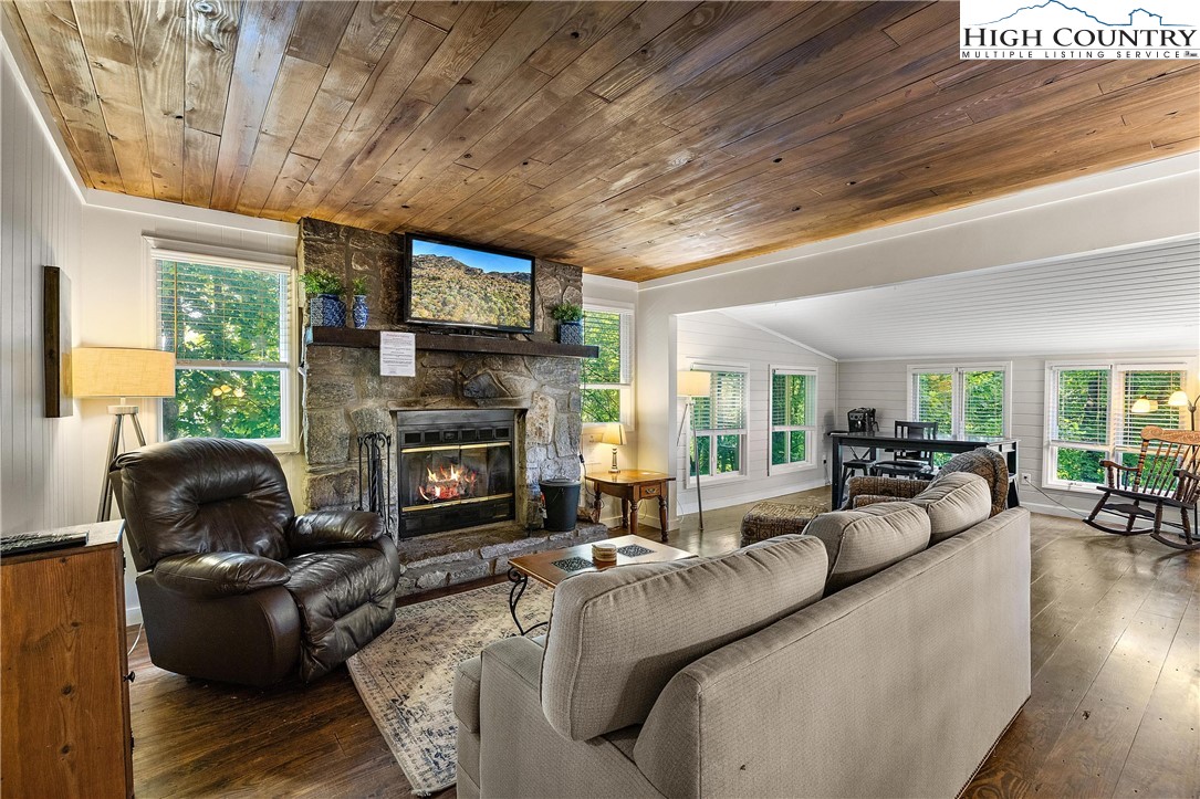 132 Sassafras Deep Gap, NC 28618 - Photo 6 of 33 a living room with furniture and a fireplace