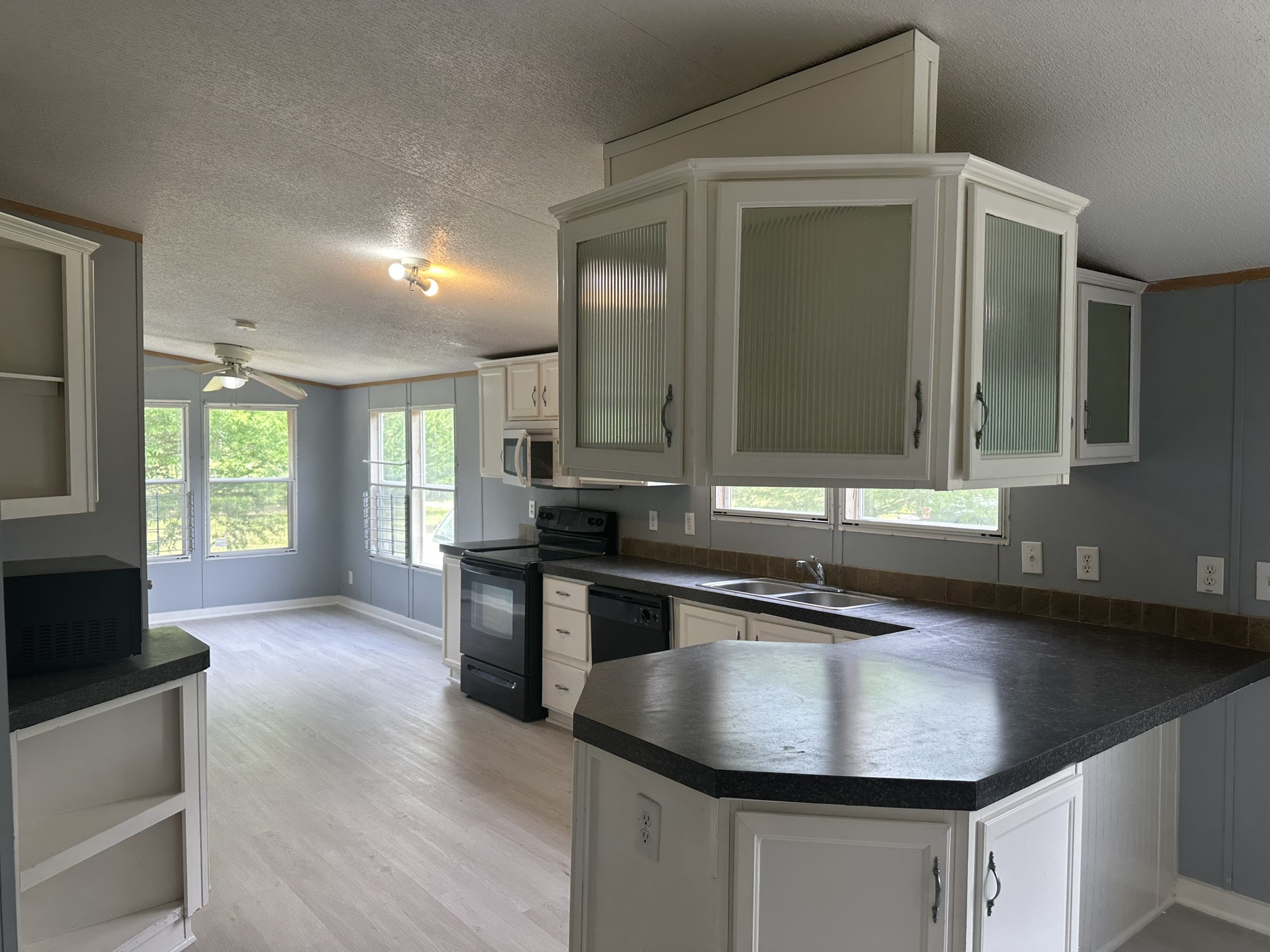 2229 Meekins Road Cleveland, TX 77328 - Photo 5 of 48 a kitchen with kitchen island granite countertop a sink a counter top space and stainless steel appliances