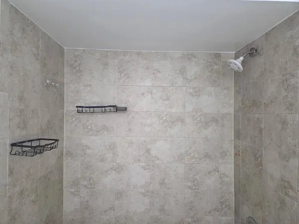 a view of a backyard and tub