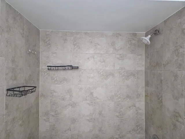 a view of a backyard and tub