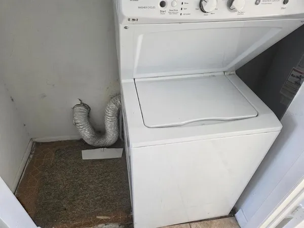 an empty room with mirror