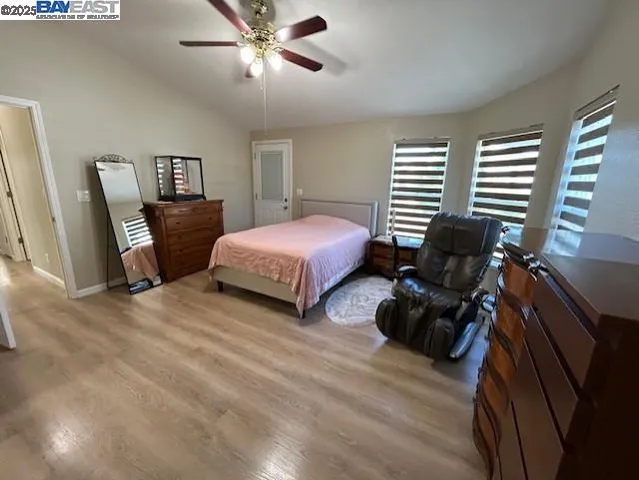 a bedroom with a bed furniture and a window