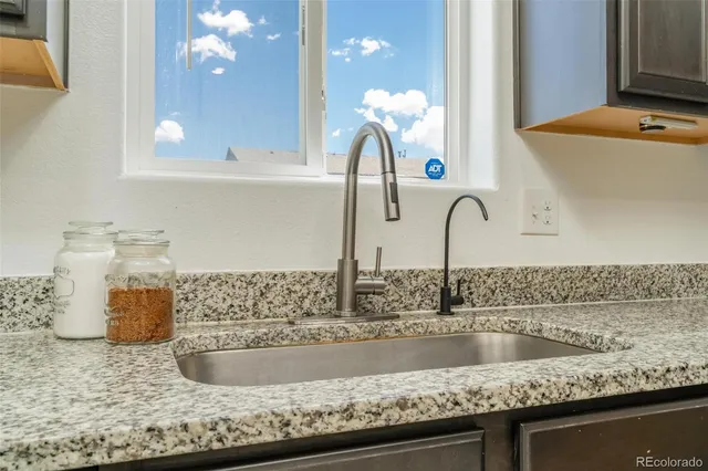 a kitchen with a sink and a stove