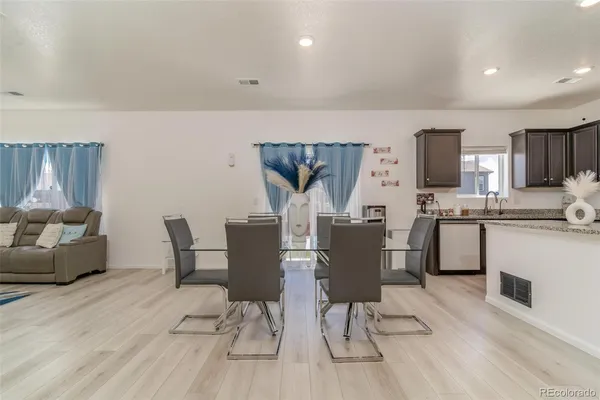 a view of kitchen with cabinets and wooden floor