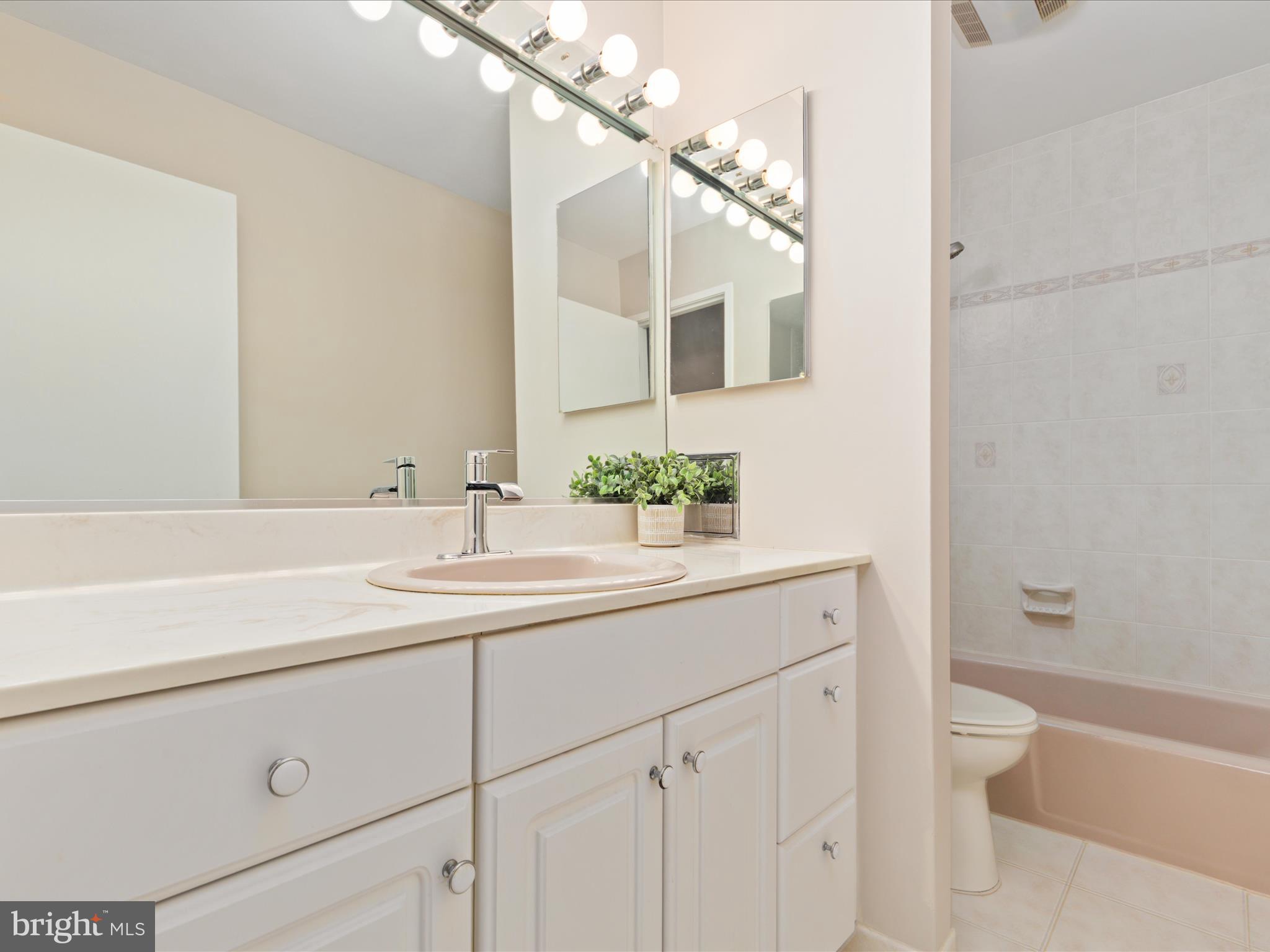 11726 Indian Ridge Road Reston, VA 20191 - Photo 19 of 67 a bathroom with a sink a toilet and shower