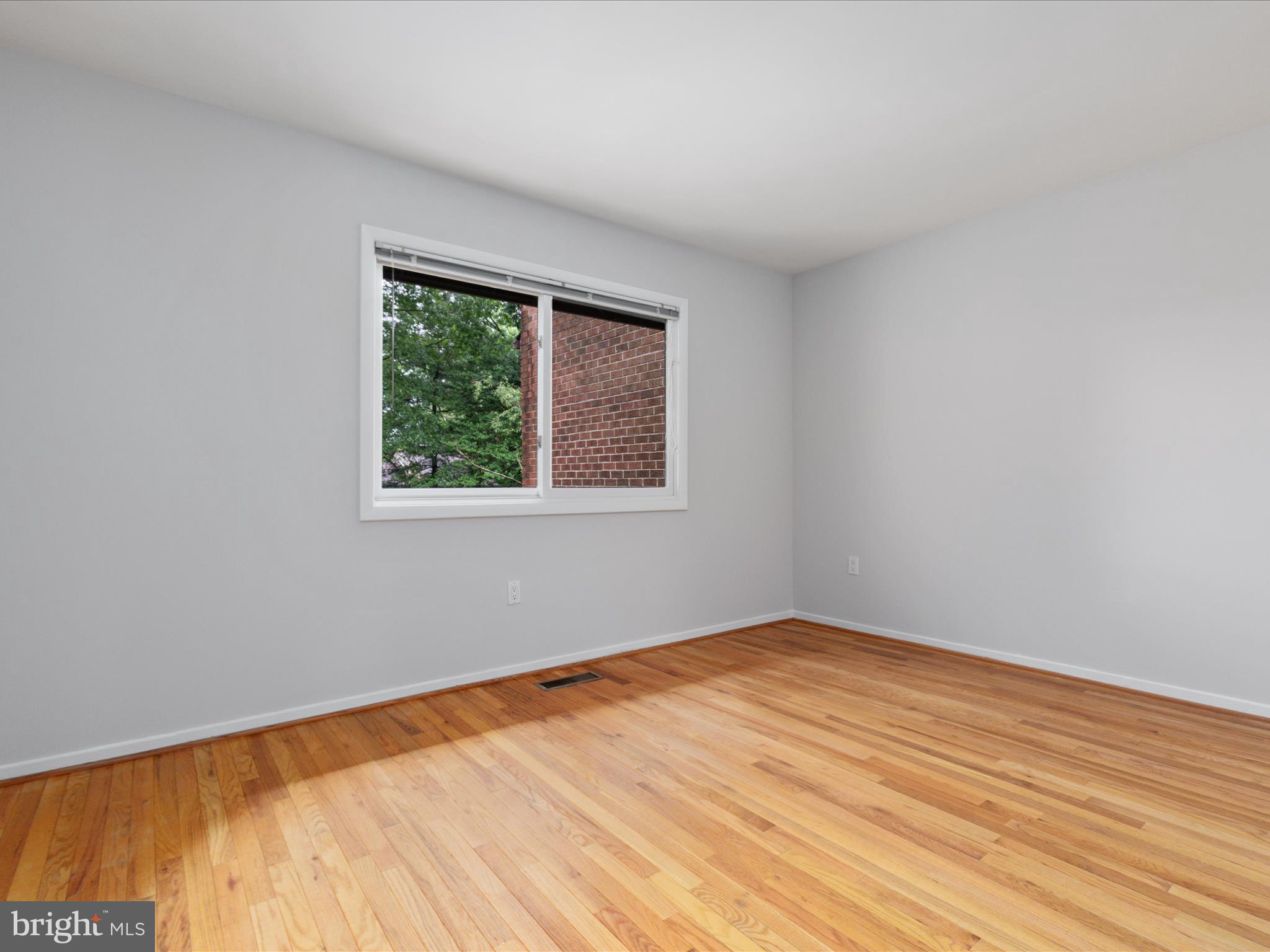 11726 Indian Ridge Road Reston, VA 20191 - Photo 22 of 67 a view of empty room with wooden floor