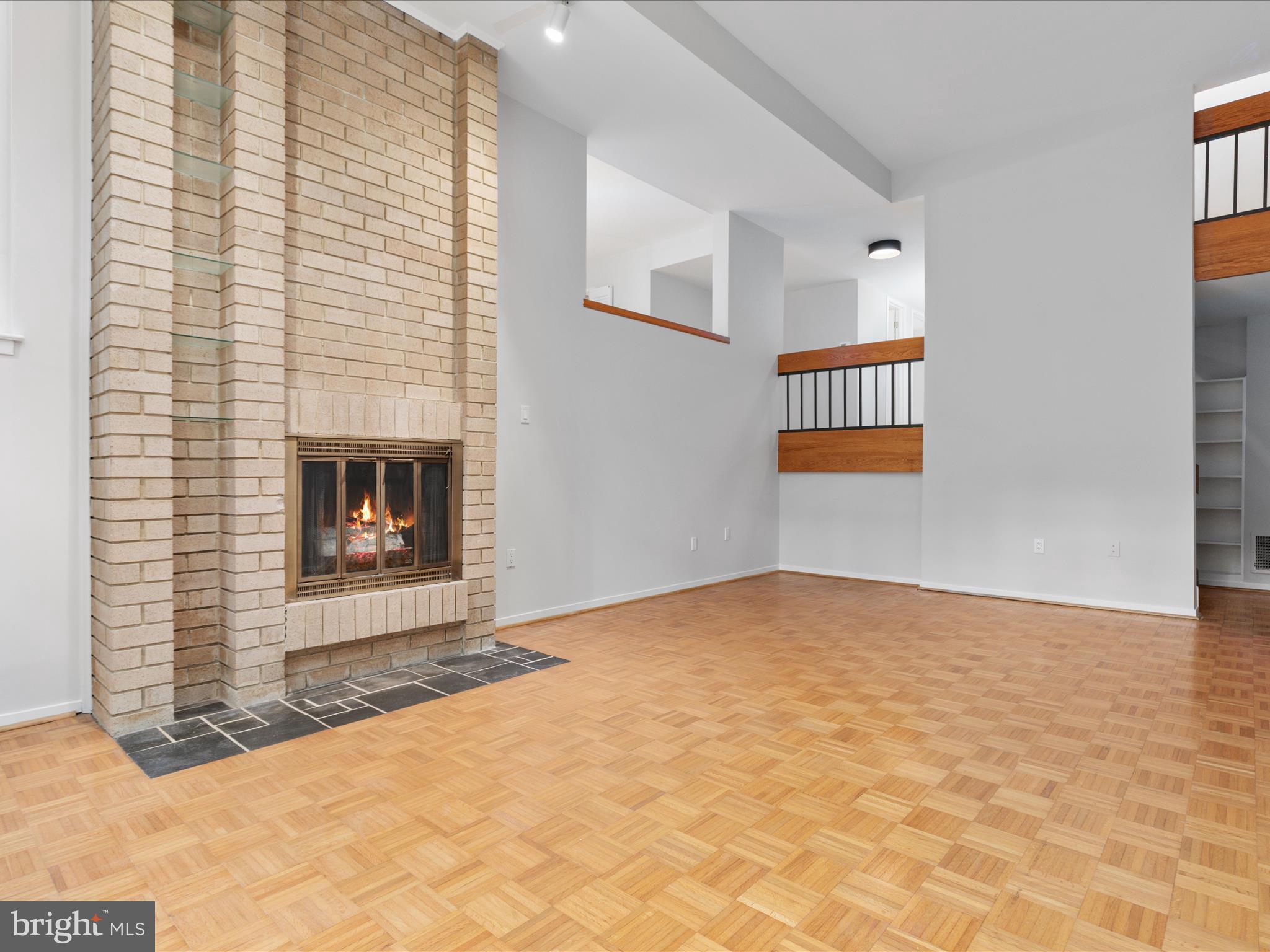 11726 Indian Ridge Road Reston, VA 20191 - Photo 28 of 67 a view of an empty room with a fireplace and a window