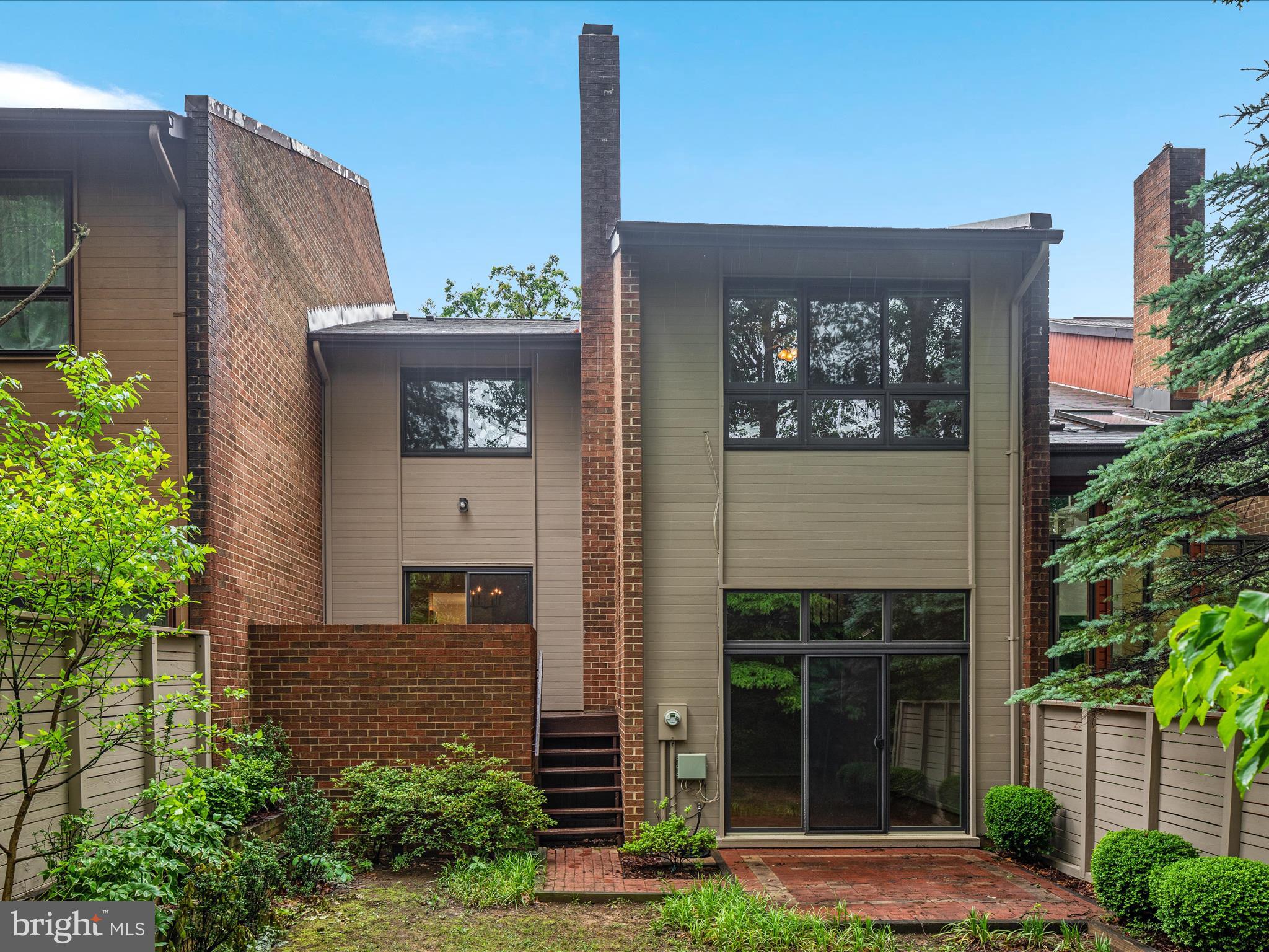 11726 Indian Ridge Road Reston, VA 20191 - Photo 32 of 67 a front view of a house with garden