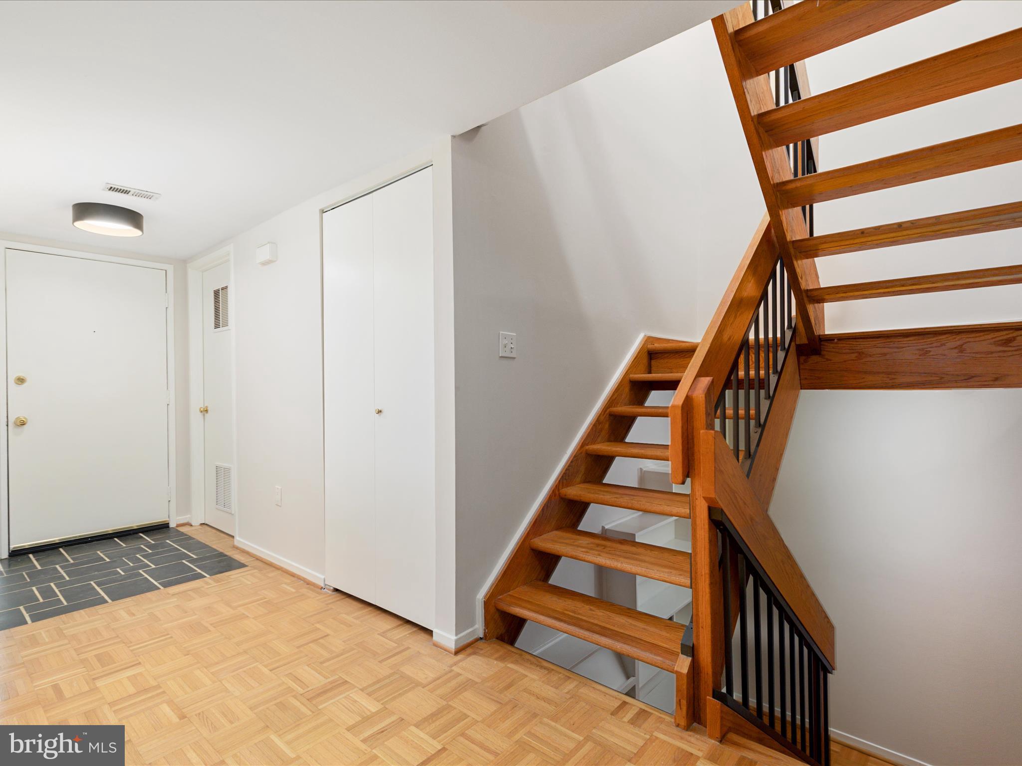 11726 Indian Ridge Road Reston, VA 20191 - Photo 5 of 67 a view of entryway with wooden floor and stairs