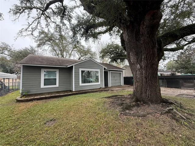 a house with trees in the background