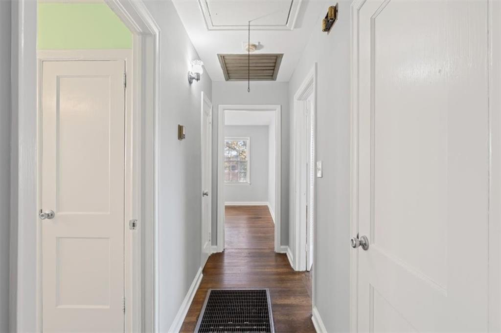 449 10th Street Northwest Atlanta, GA 30318 - Photo 15 of 40 a view of a hallway with wooden floor and staircase