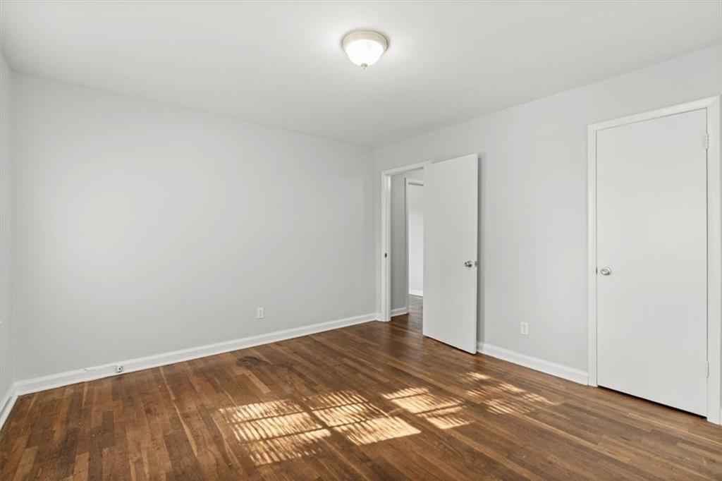 449 10th Street Northwest Atlanta, GA 30318 - Photo 16 of 40 a view of an empty room and wooden floor