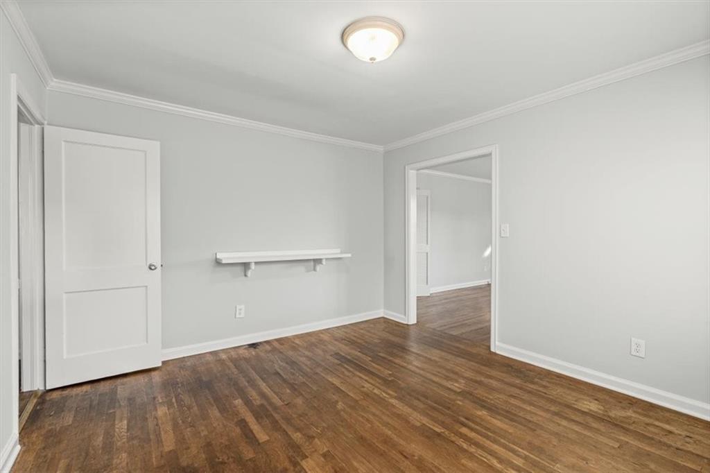 449 10th Street Northwest Atlanta, GA 30318 - Photo 23 of 40 a view of an empty room with wooden floor