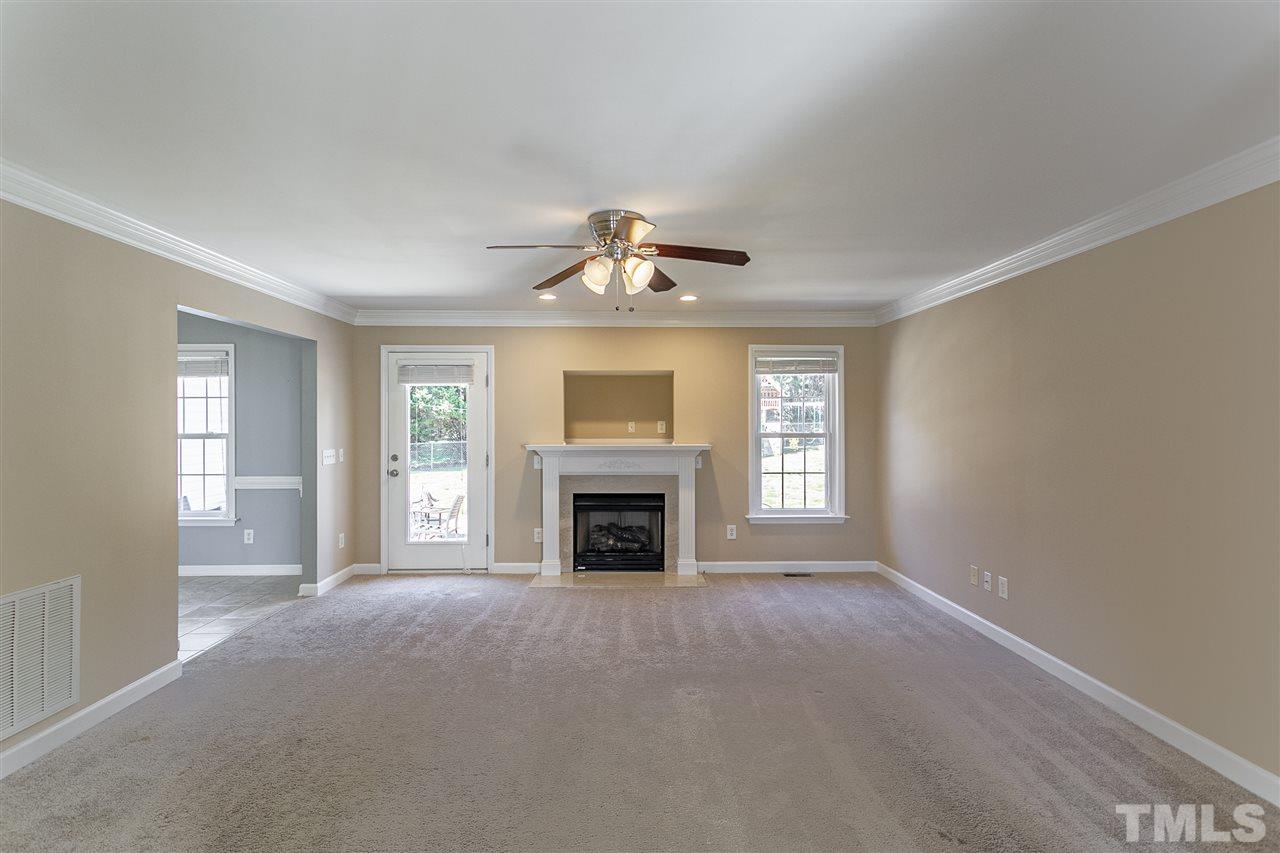 156 Fork Junction Road Timberlake, NC 27583 - Photo 12 of 30 a view of livingroom with fireplace fan and windows