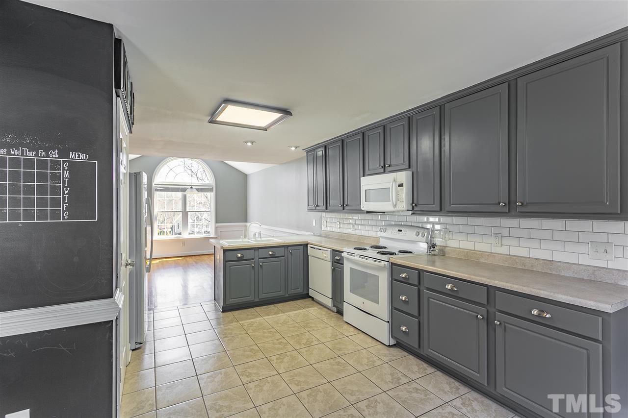 156 Fork Junction Road Timberlake, NC 27583 - Photo 14 of 30 a large kitchen with cabinets and wooden floor