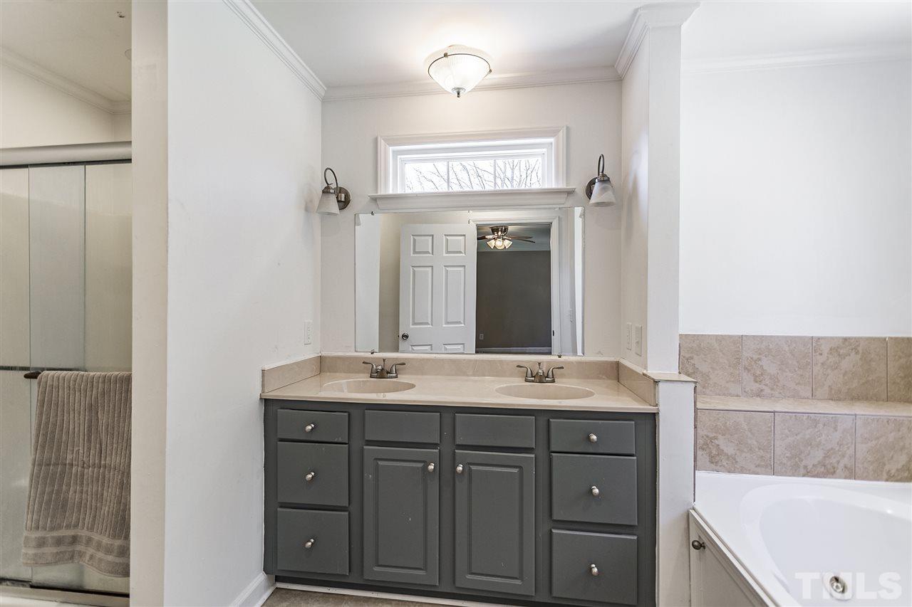 156 Fork Junction Road Timberlake, NC 27583 - Photo 20 of 30 a bathroom with a sink and a mirror