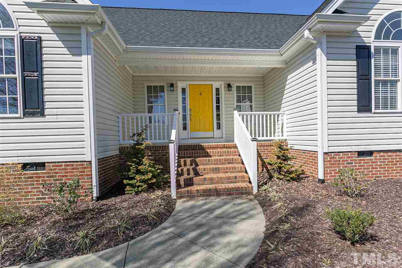 156 Fork Junction Road Timberlake, NC 27583 - Photo 3 of 30 a front view of a house with barbeque and sitting area