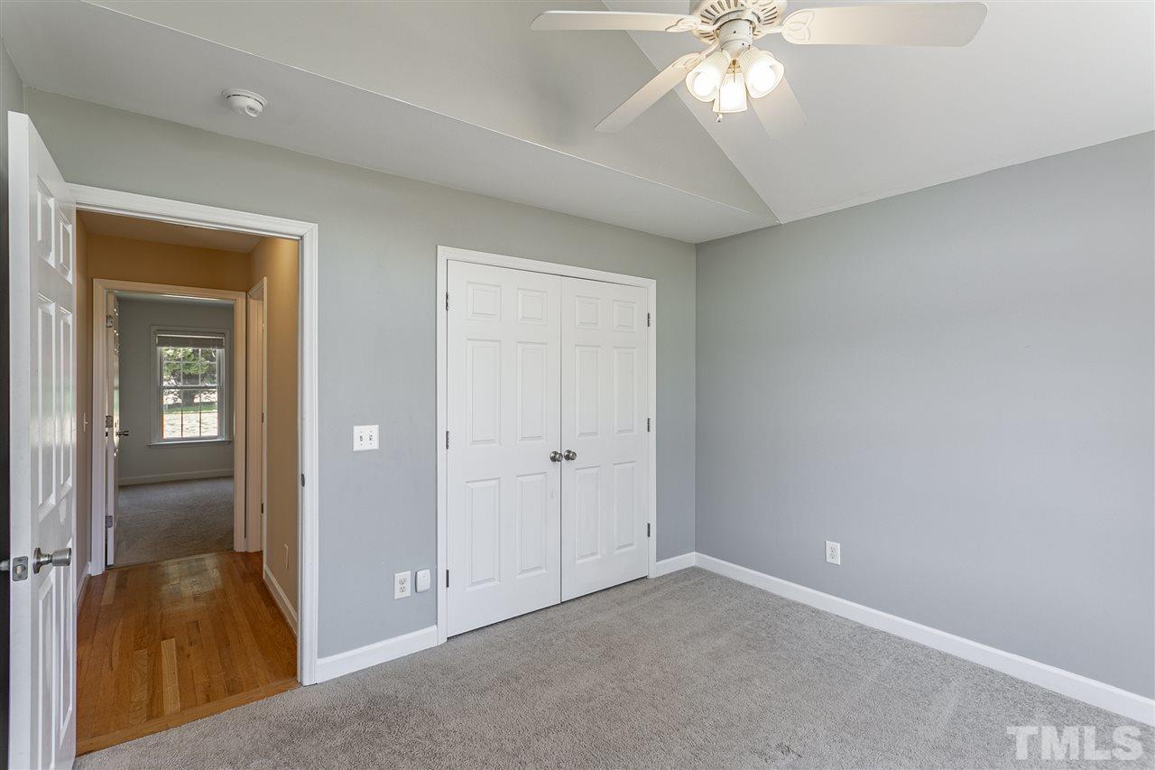 156 Fork Junction Road Timberlake, NC 27583 - Photo 22 of 30 wooden floor in an empty room and a window