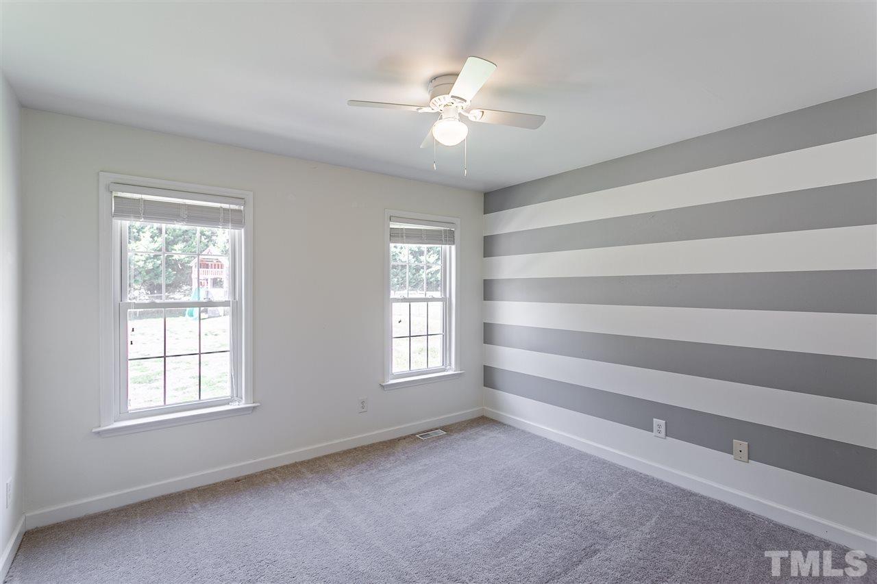 156 Fork Junction Road Timberlake, NC 27583 - Photo 23 of 30 a view of room with window and ceiling fan