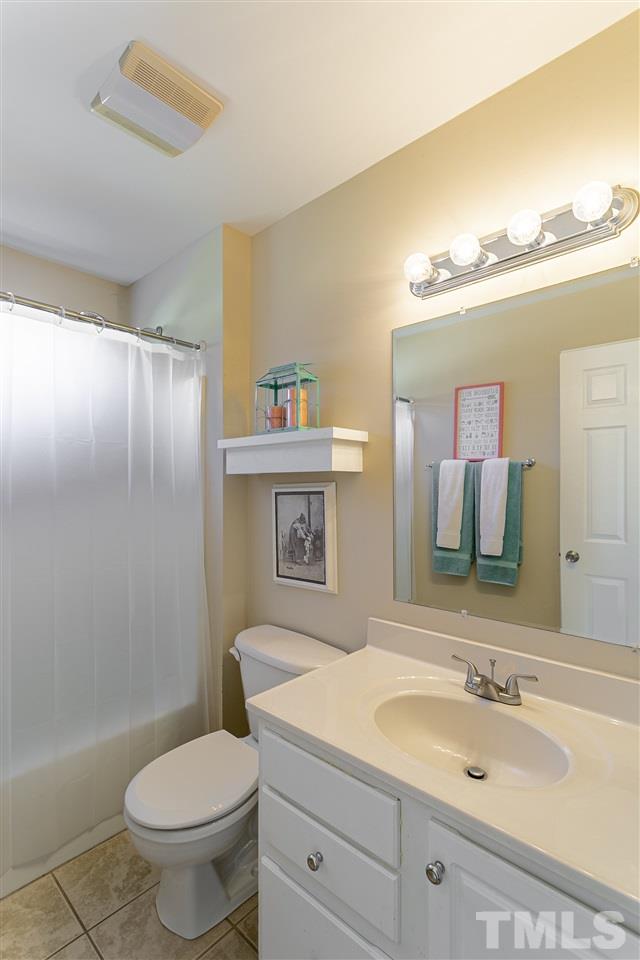 156 Fork Junction Road Timberlake, NC 27583 - Photo 25 of 30 a bathroom with a sink a toilet and shower
