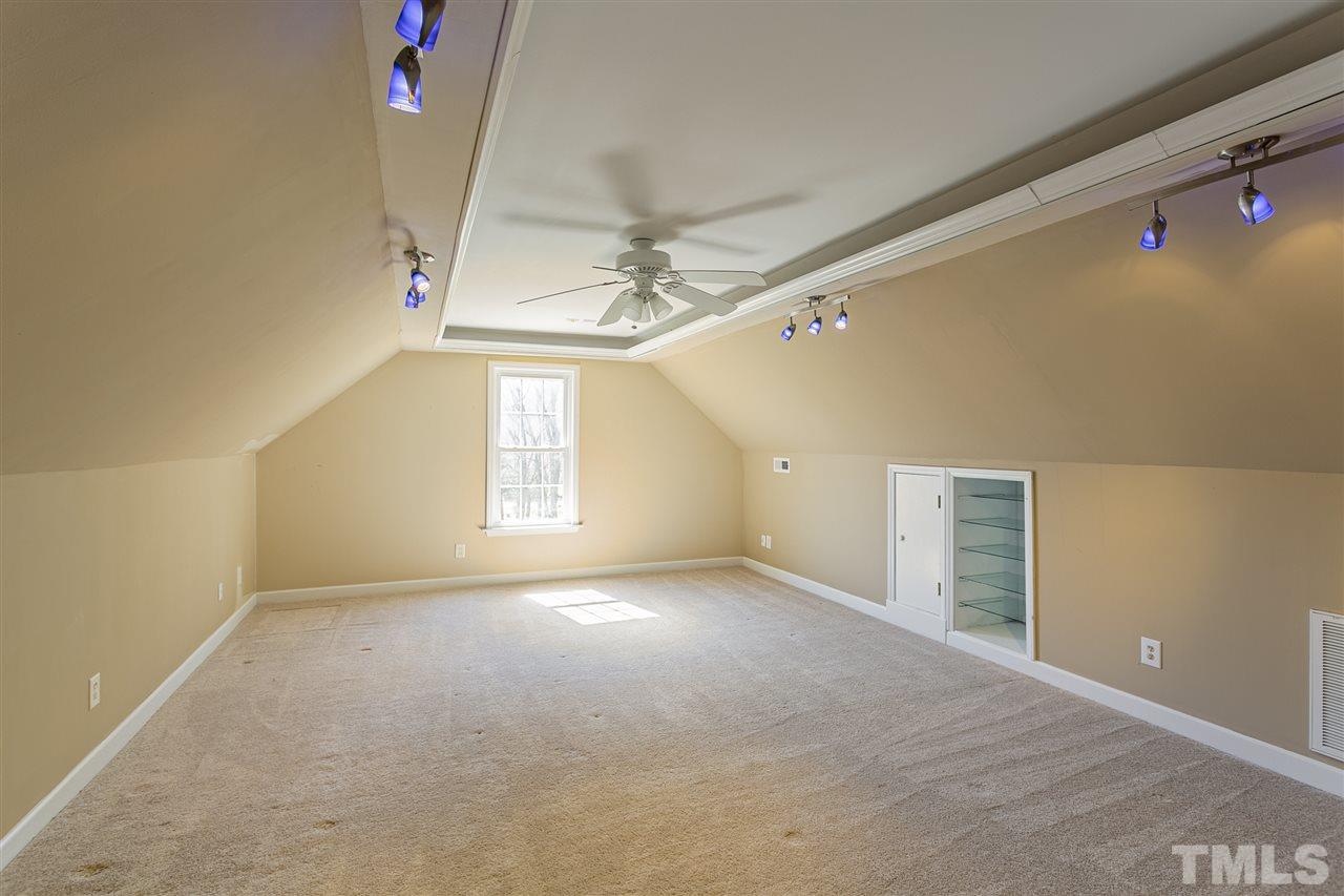 156 Fork Junction Road Timberlake, NC 27583 - Photo 26 of 30 a view of a livingroom with a ceiling fan and window