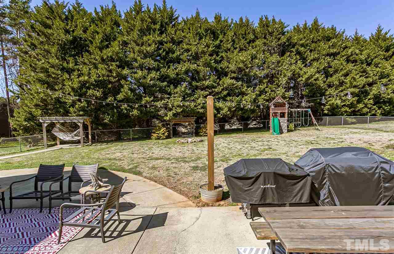 156 Fork Junction Road Timberlake, NC 27583 - Photo 10 of 30 a view of backyard with swimming pool and seating space