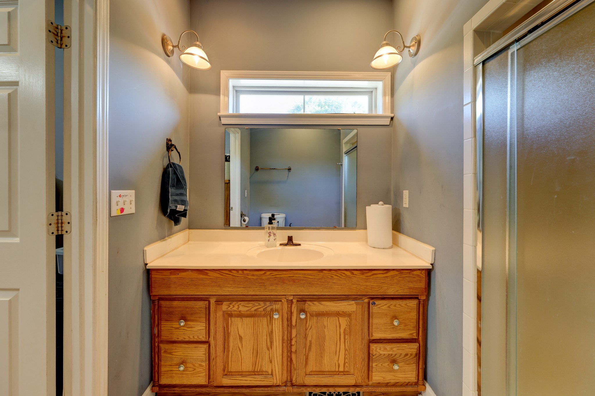 2251 Davidson Graveyard Road Clarksville, TN 37043 - Photo 50 of 78 a bathroom with a sink vanity and a mirror
