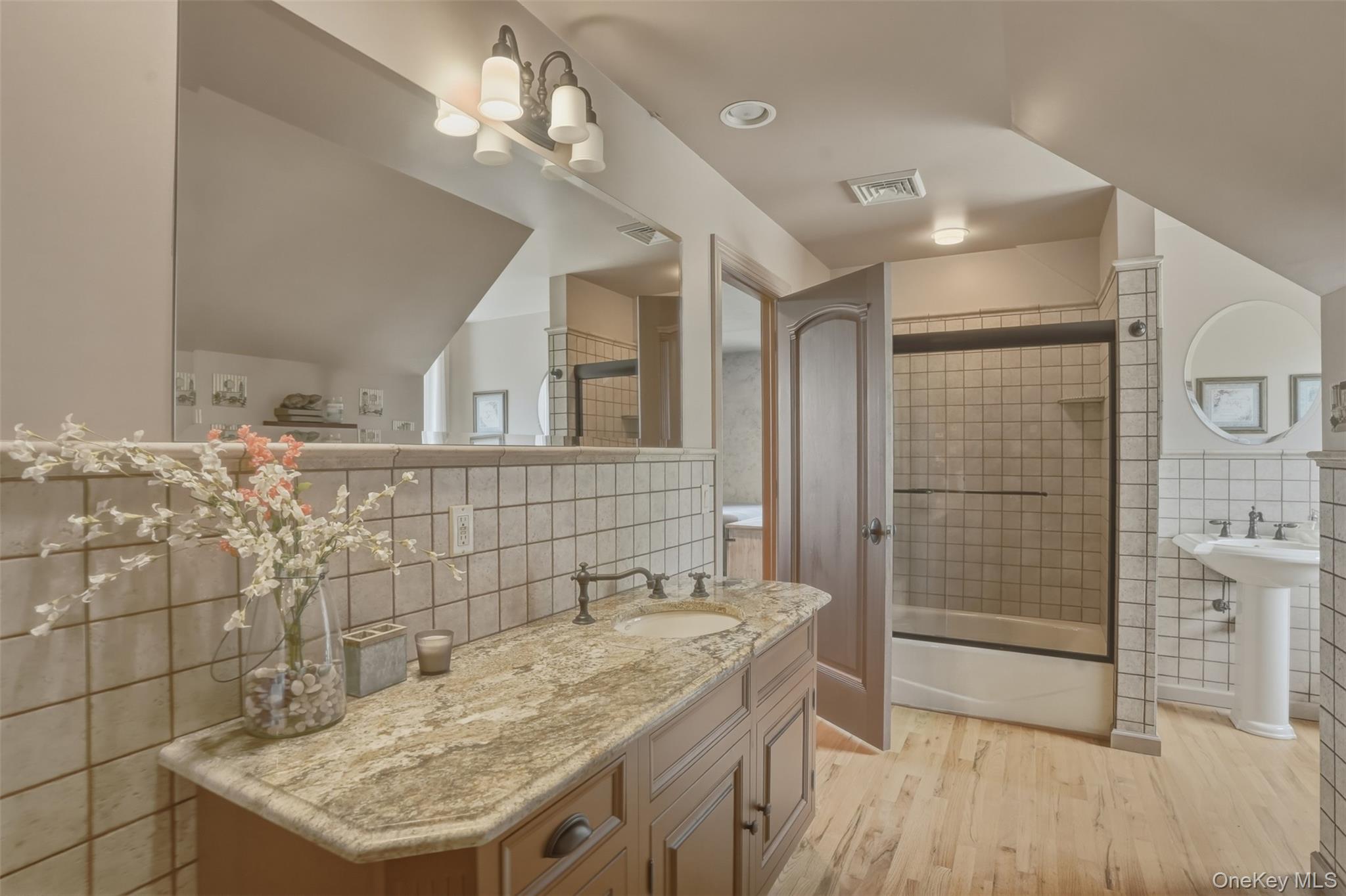 95 Judson Road Montgomery, NY 12549 - Photo 25 of 50 Upstairs, two generously sized bedrooms share a full bath, while a peaceful loft-style sitting area overlooks both the great room below and the picturesque grounds beyond.