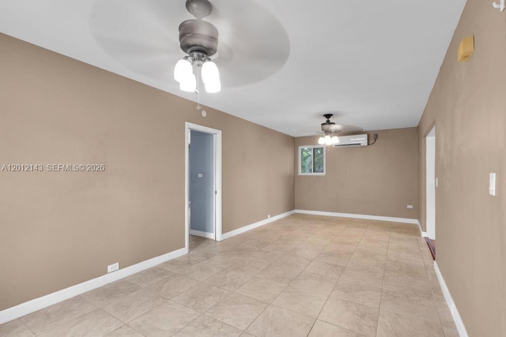 5651 Northwest 3rd Street Miami, FL 33126 - Photo 9 of 21 a view of an empty room with a chandelier fan