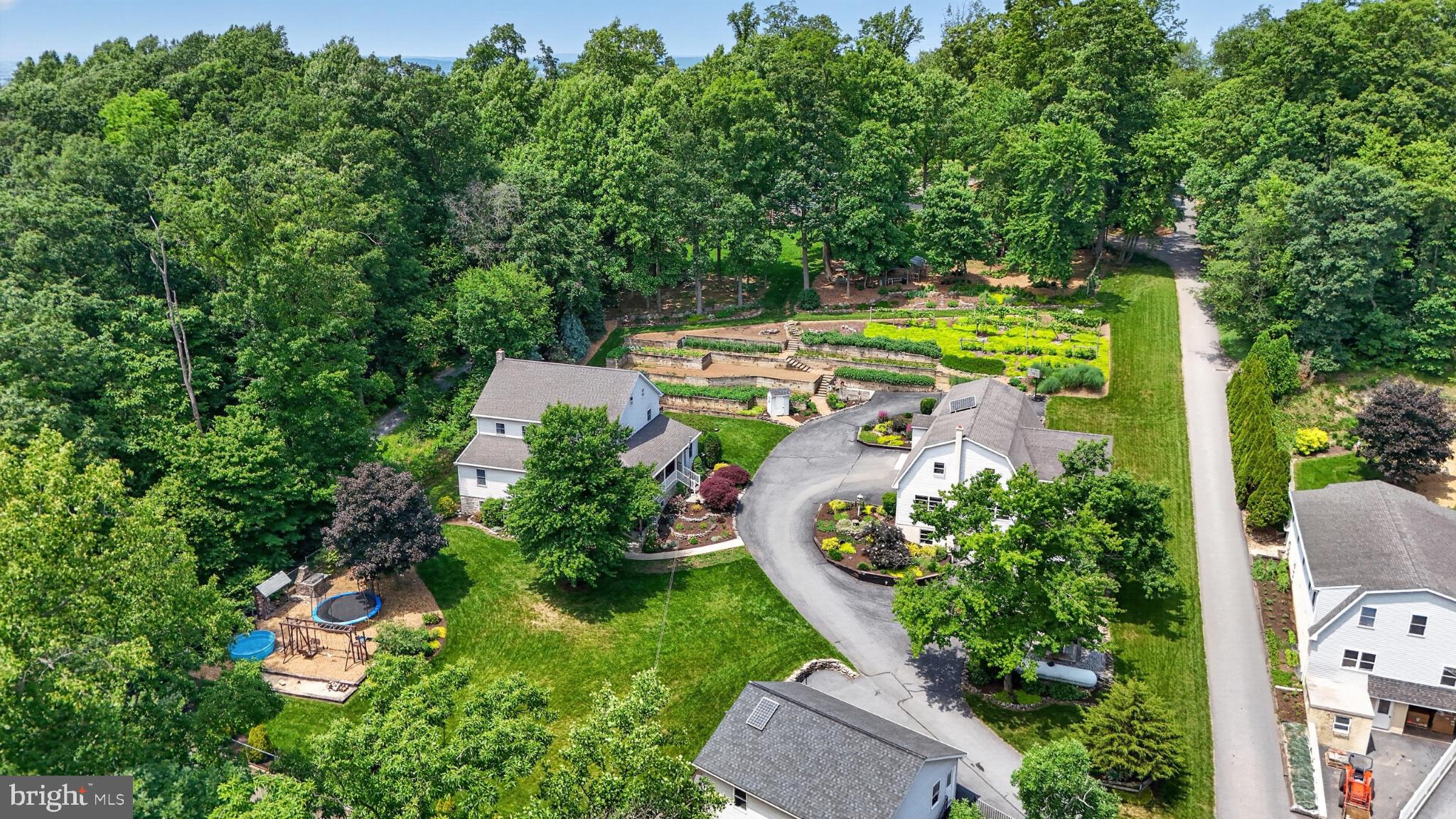 257 Hill Road New Holland, PA 17557 - Photo 12 of 94 Serene homes nestled in lush greenery.