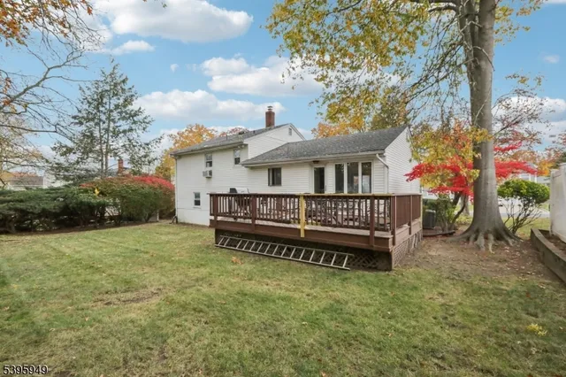a view of a chairs on wooden deck