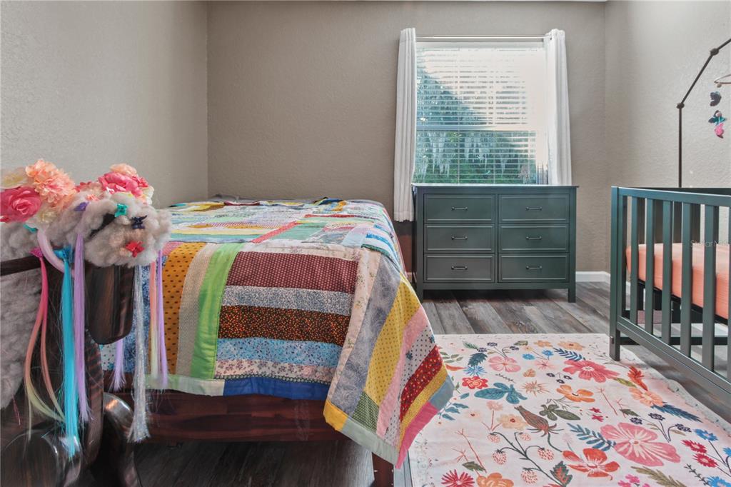 6312 Central Avenue Coleman, FL 34785 - Photo 11 of 25 a bedroom with a bed and a window