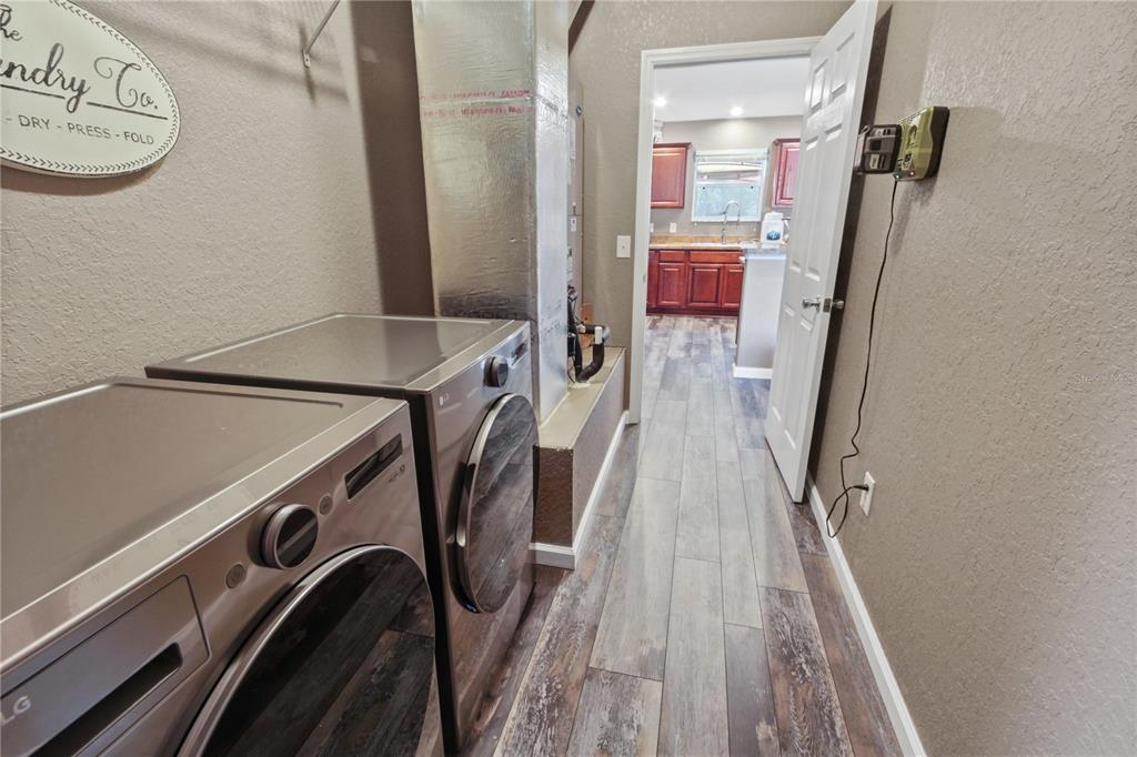 6312 Central Avenue Coleman, FL 34785 - Photo 12 of 25 a view of a storage and utility room with racks on the wall