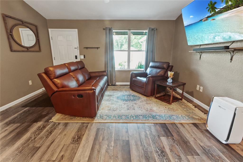 6312 Central Avenue Coleman, FL 34785 - Photo 2 of 25 a living room with furniture and a window