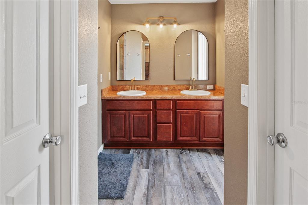 6312 Central Avenue Coleman, FL 34785 - Photo 21 of 25 a view of en suite bathroom with a sink and a mirror