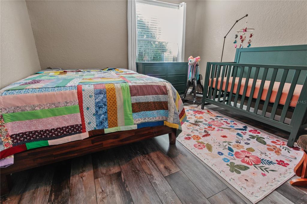 6312 Central Avenue Coleman, FL 34785 - Photo 24 of 25 a bedroom with a bed and a window