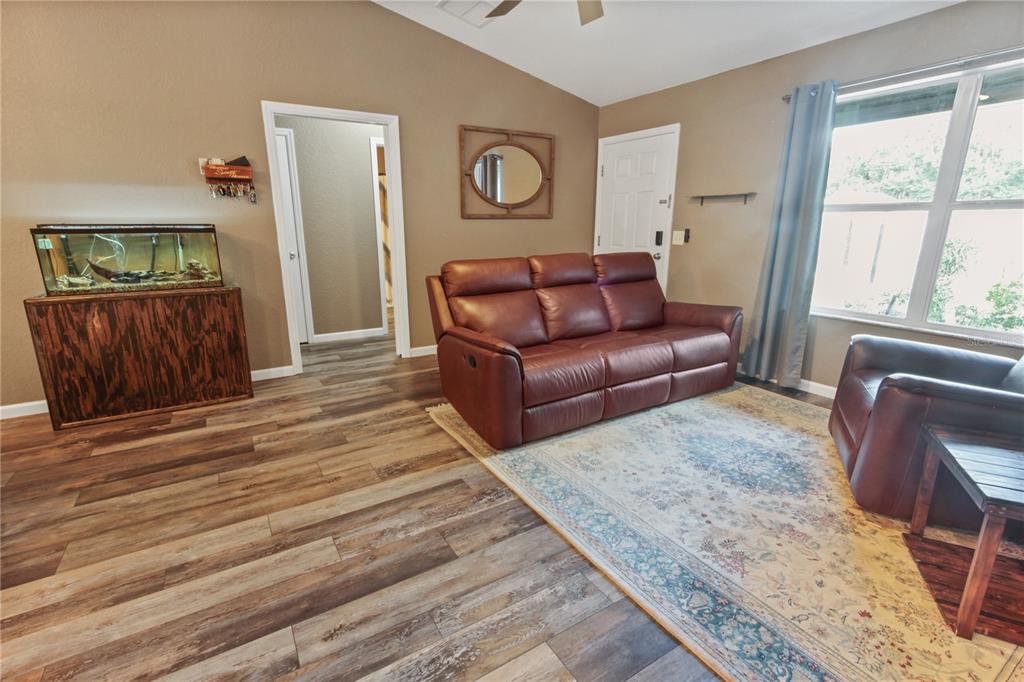 6312 Central Avenue Coleman, FL 34785 - Photo 6 of 25 a living room with furniture and a window