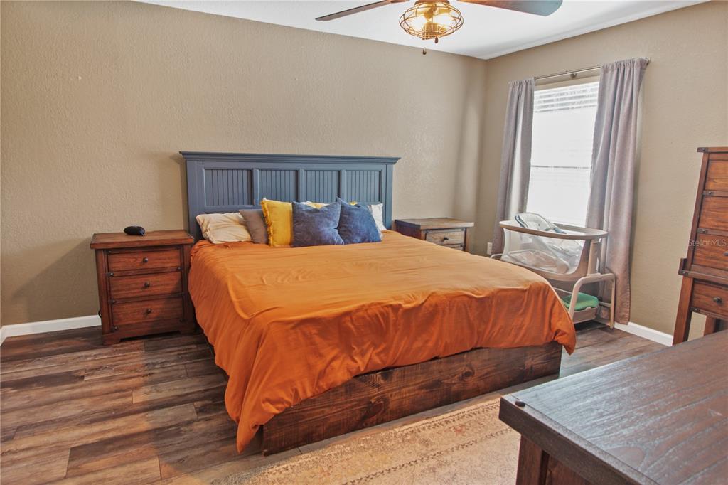 6312 Central Avenue Coleman, FL 34785 - Photo 7 of 25 a bedroom with a bed and a dresser