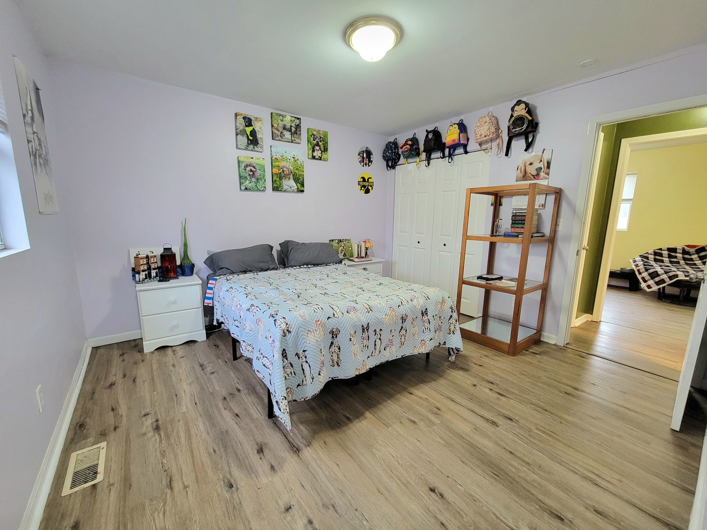 486 West Washington Street St. Anne, IL 60964 - Photo 11 of 14 a bedroom with a bed and a wooden floor
