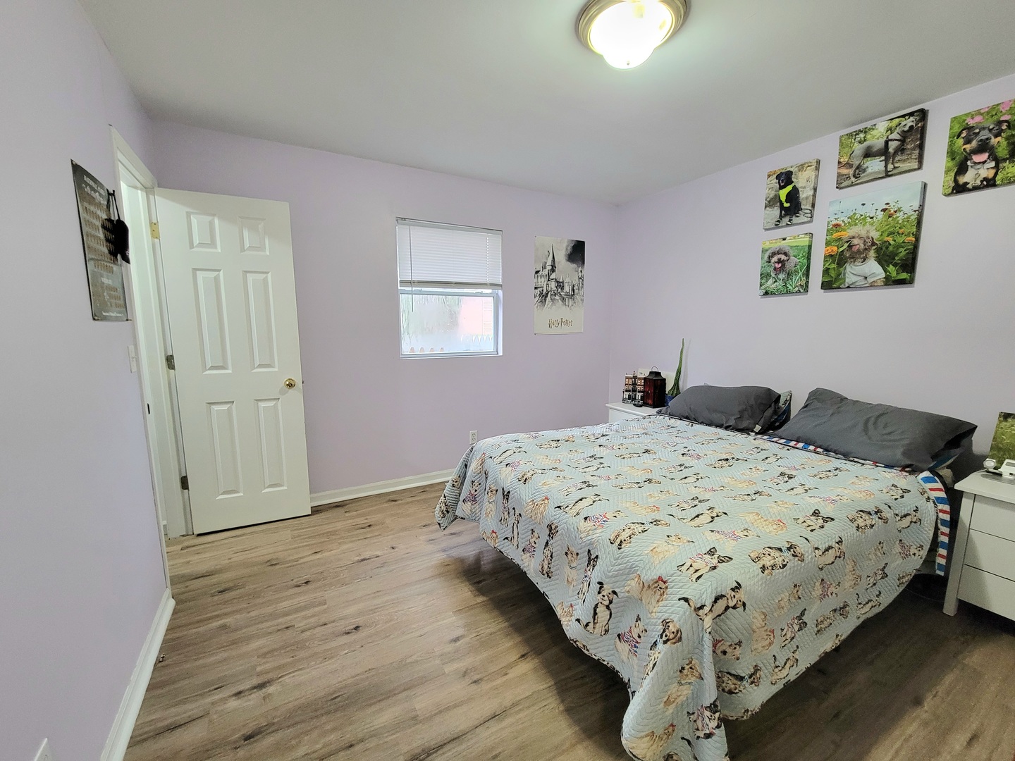 486 West Washington Street St. Anne, IL 60964 - Photo 10 of 14 a bedroom with a bed and painting on the wall