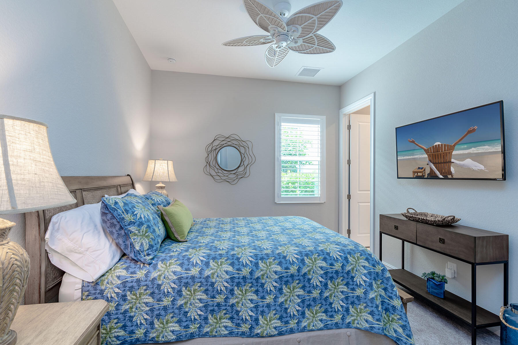 3192 Capistrano Lane Naples, FL 34114 - Photo 14 of 38 a bedroom with a bed and a flat screen tv