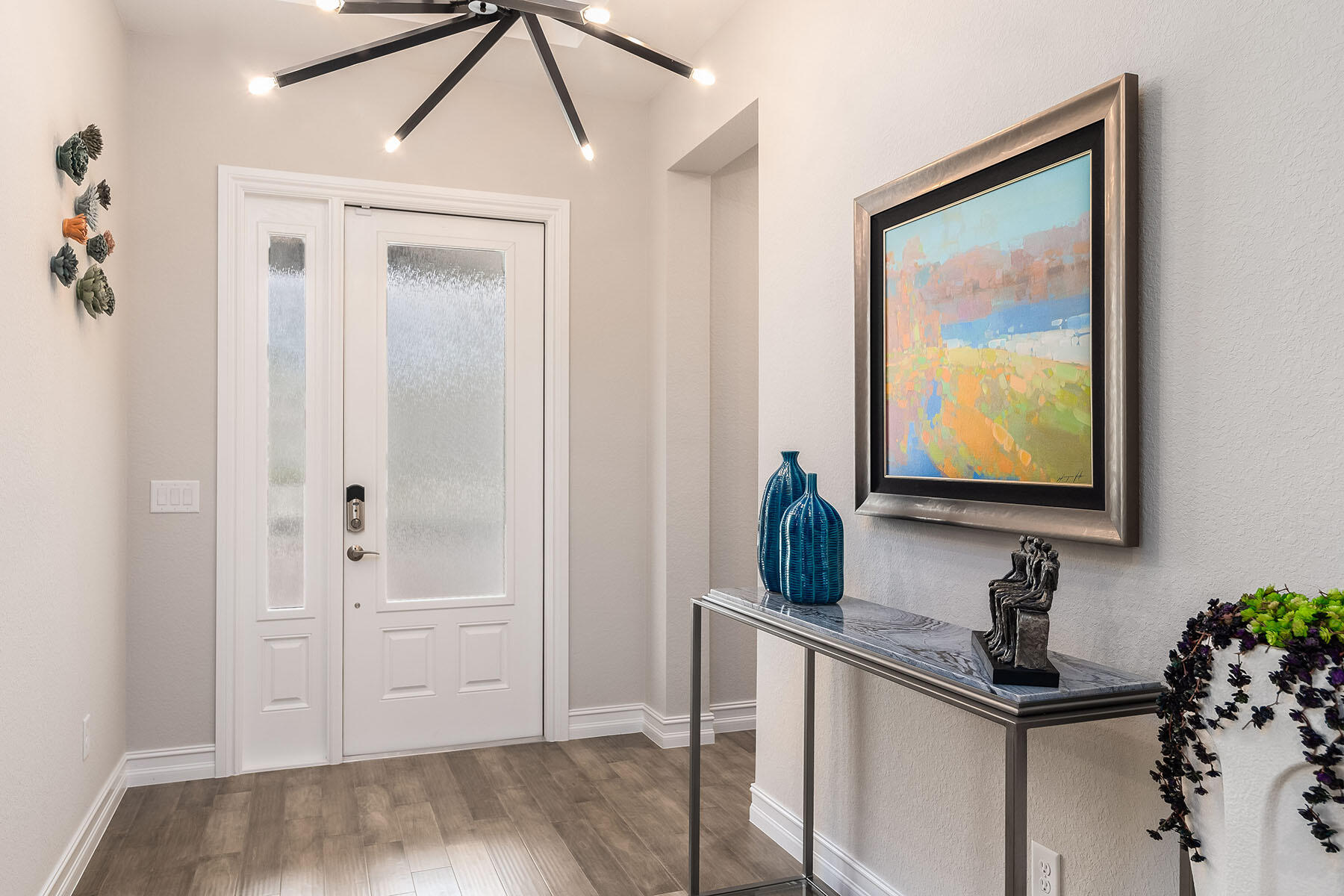 3192 Capistrano Lane Naples, FL 34114 - Photo 2 of 38 a bathroom with a sink and a mirror