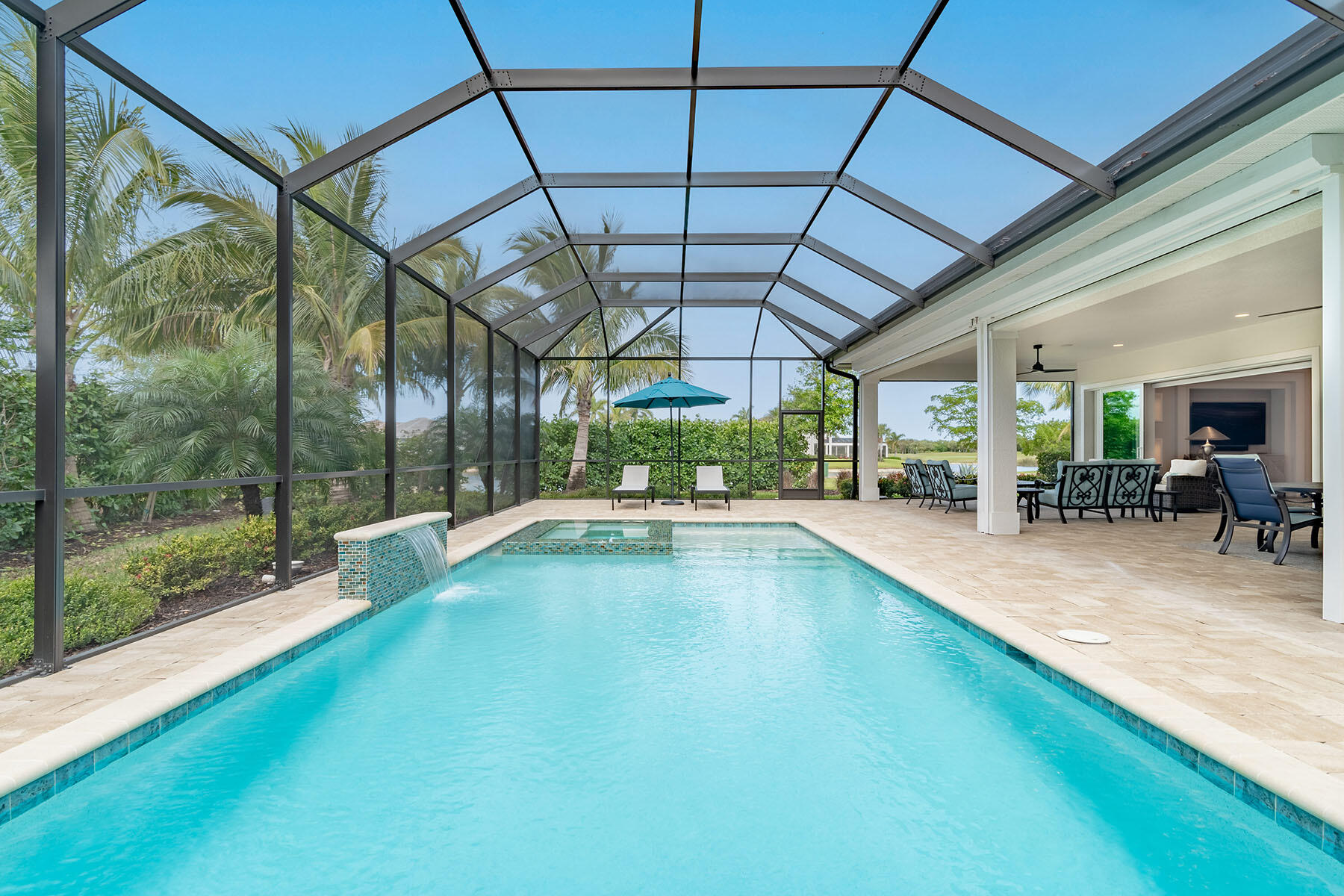 3192 Capistrano Lane Naples, FL 34114 - Photo 27 of 38 a view of swimming pool with outdoor seating