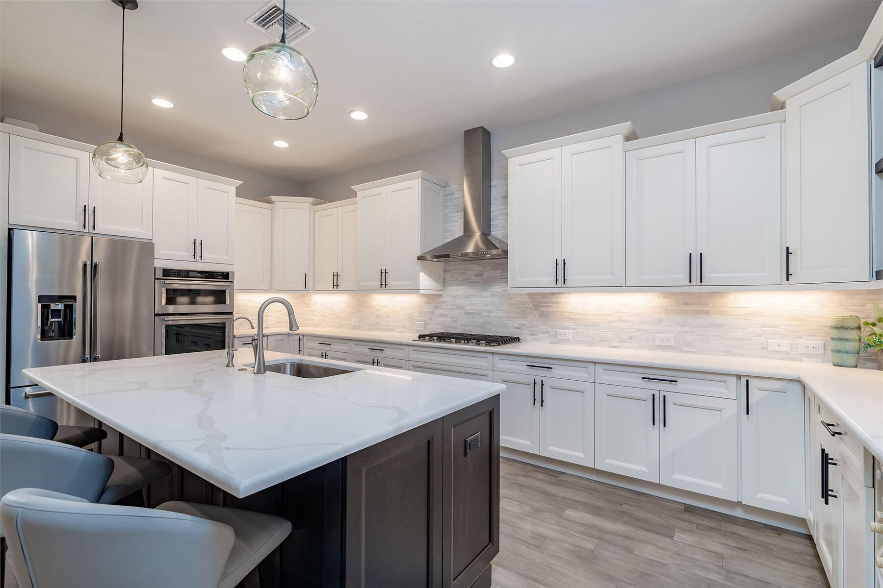 3192 Capistrano Lane Naples, FL 34114 - Photo 5 of 38 a kitchen with stainless steel appliances granite countertop a sink a stove and a refrigerator