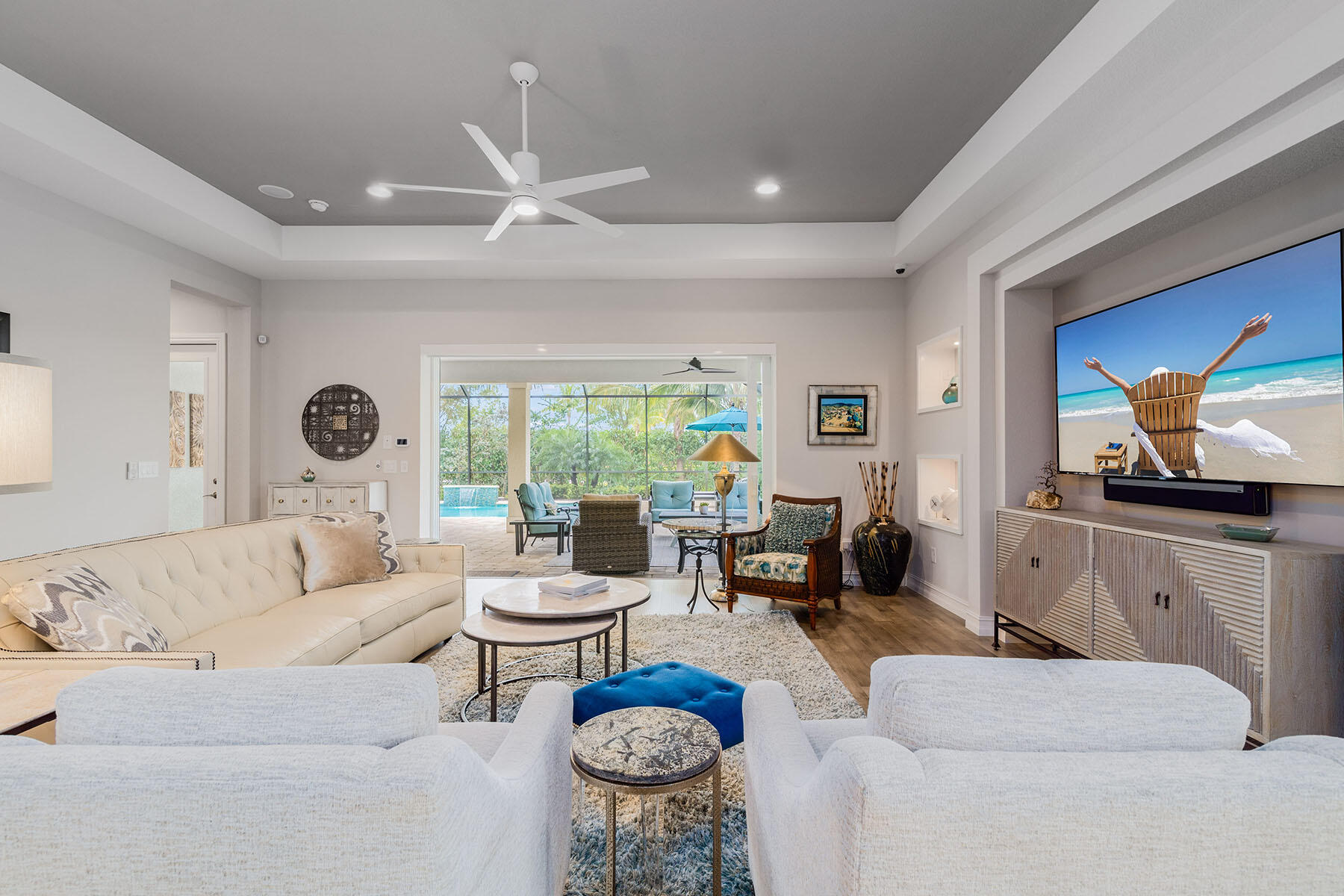 3192 Capistrano Lane Naples, FL 34114 - Photo 8 of 38 a living room with furniture fireplace and a large window