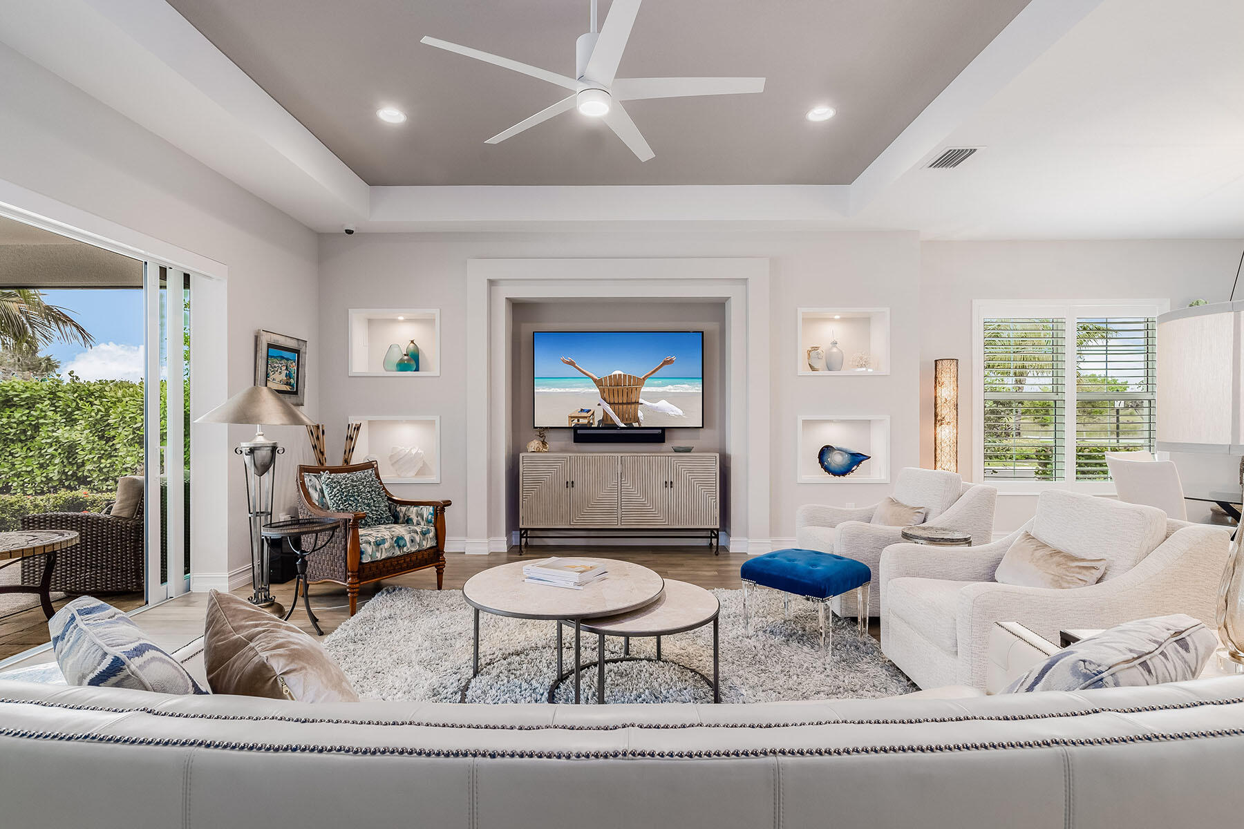 3192 Capistrano Lane Naples, FL 34114 - Photo 9 of 38 a living room with furniture and a large window