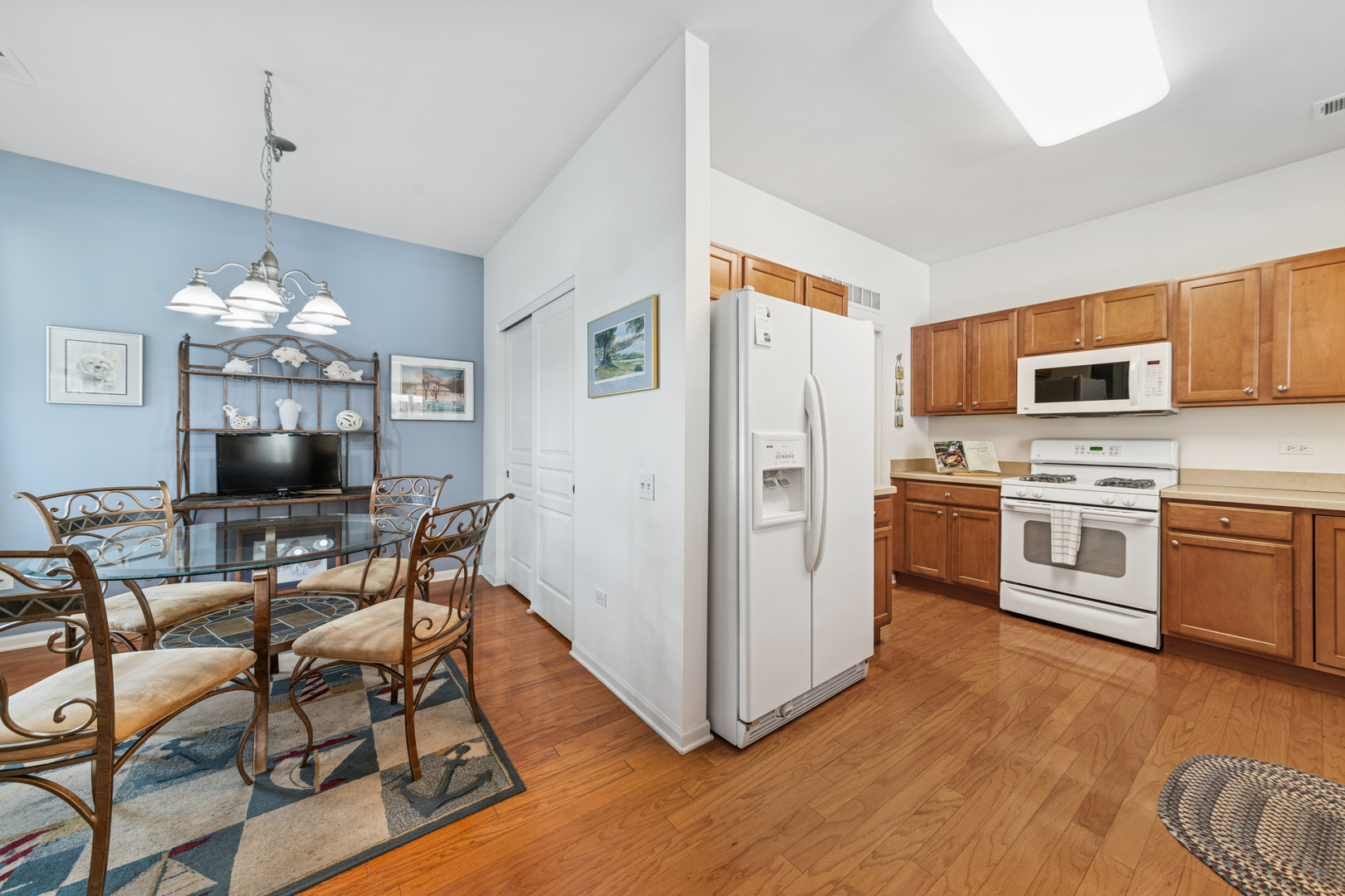 2535 Rolling Ridge Elgin, IL 60124 - Photo 4 of 20 a view of a dining room with furniture a chandelier and wooden floor