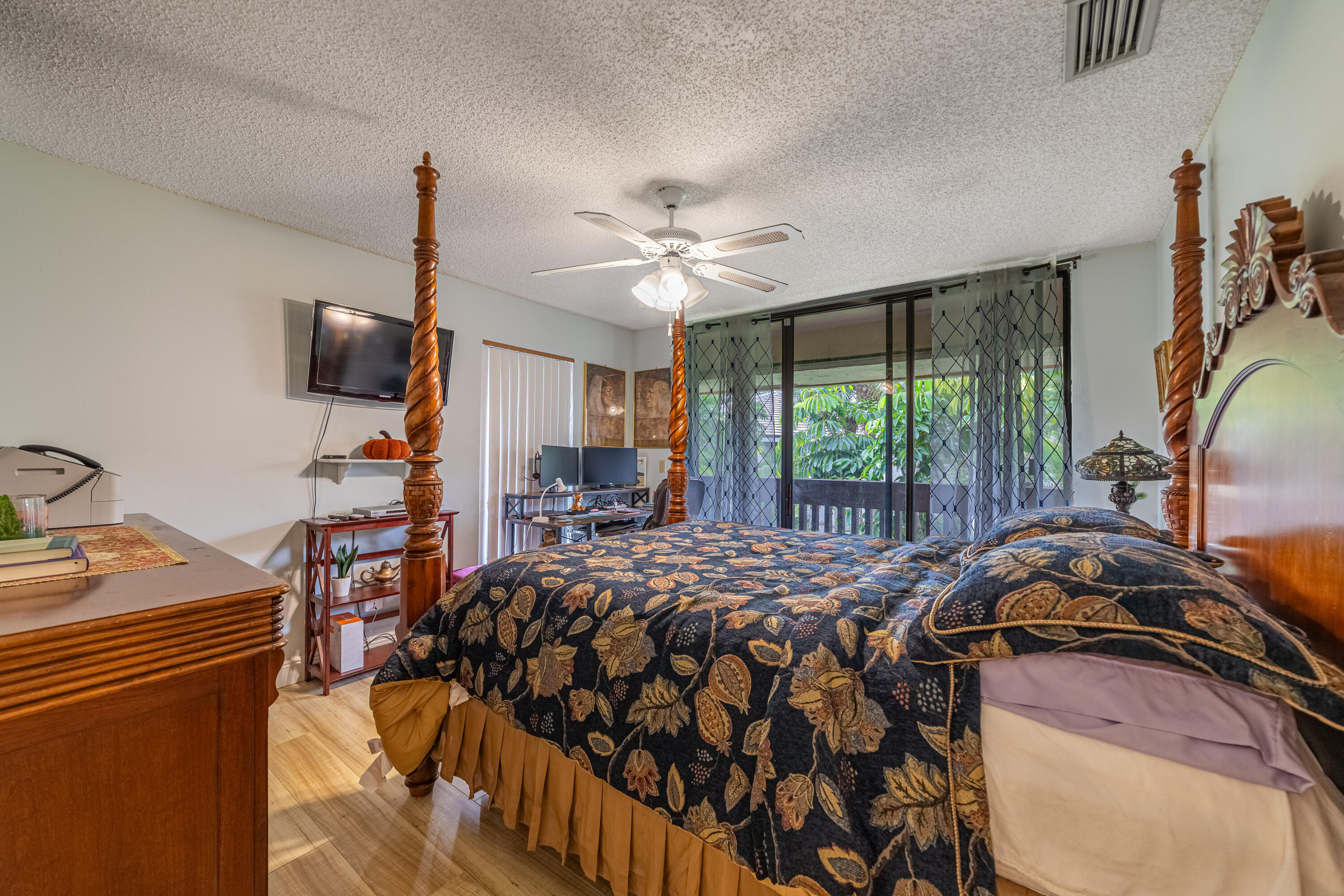 9352 Sable Ridge Circle, Unit B Boca Raton, FL 33428 - Photo 22 of 35 a bed sitting in a bedroom next to a window