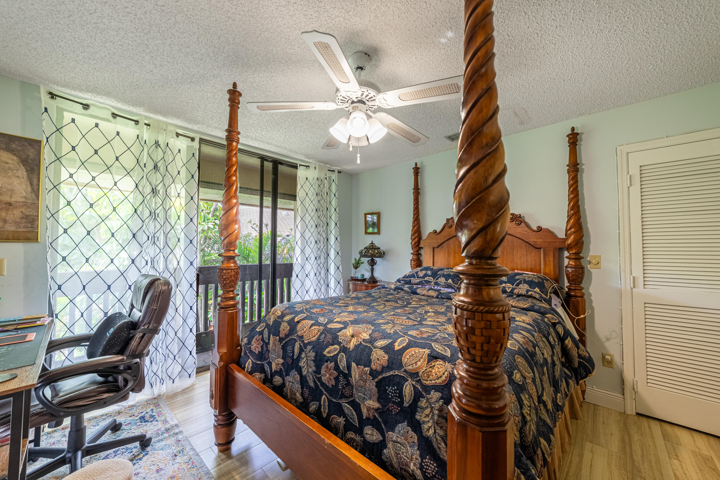 9352 Sable Ridge Circle, Unit B Boca Raton, FL 33428 - Photo 23 of 35 a bed sitting in a bedroom next to a window